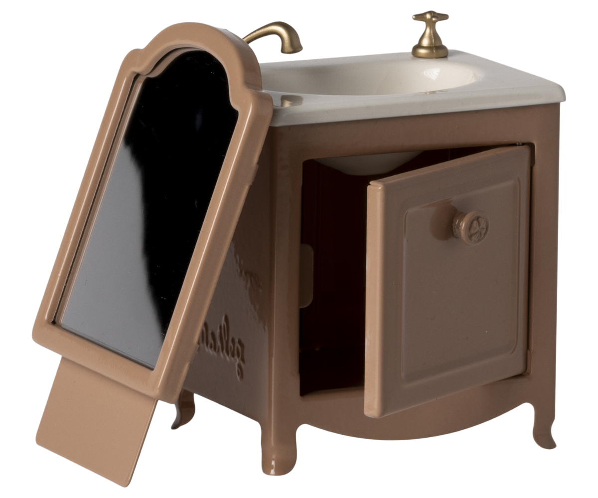 Brown doll sized vanity with mirror and sink on a white background