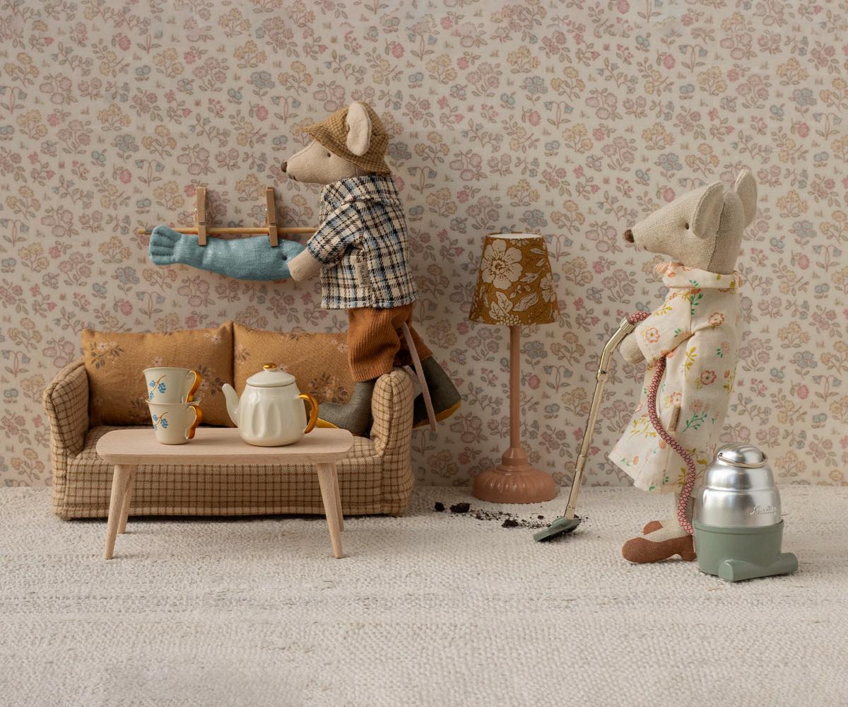 Maileg mouse living room scene featuring the mouse couch and two mice doing housework