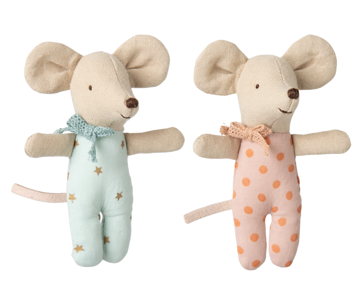 Two plush mouse toys with star-patterned outfit and polka dot outfit on a white background