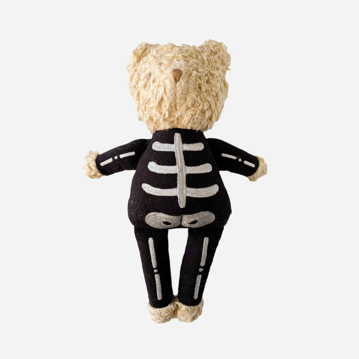 teddy bear with skeleton costume, shown on a white background