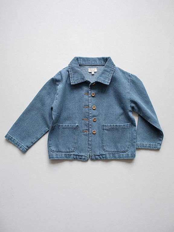 Blue denim jacket on a light gray background