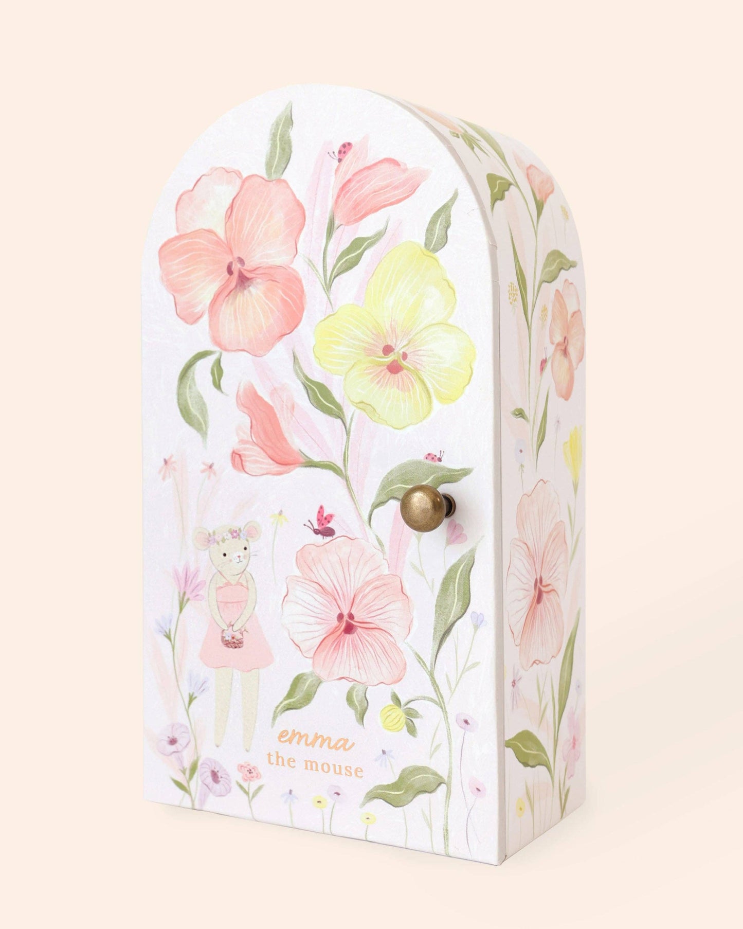 Decorative box with floral design and a gold knob on a beige background
