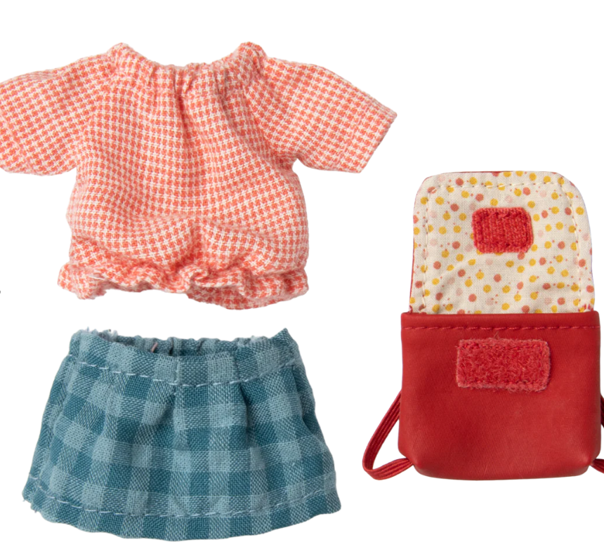 Set of doll clothes including a red checkered top, blue plaid skirt, and a red bag with a polka dot interior on a white background.