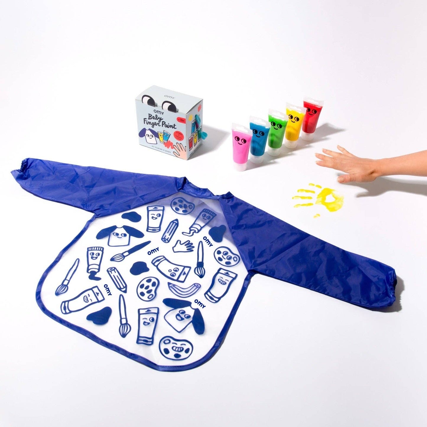 Children's art apron with cartoon illustrations, paint containers, and a handprint on a white background