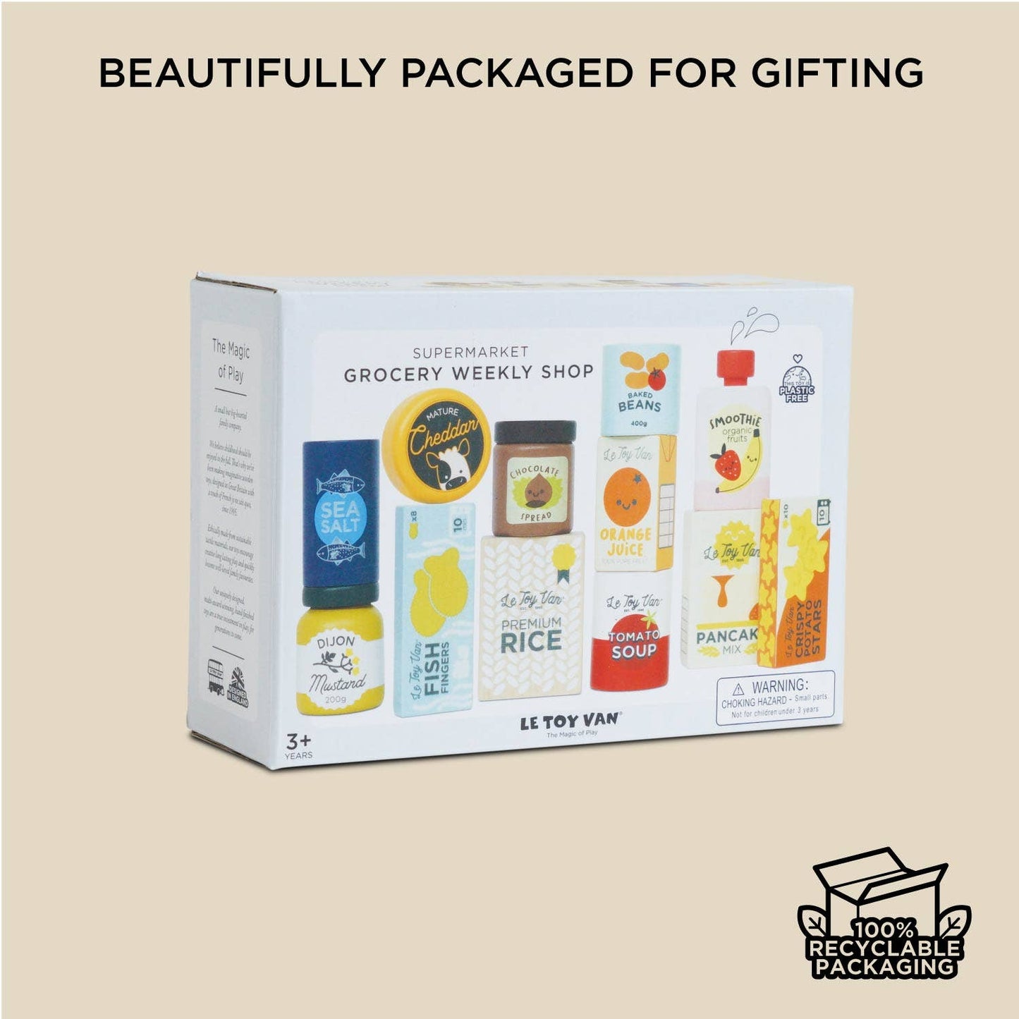 Box of toy groceries with branding and recycling information on a beige background