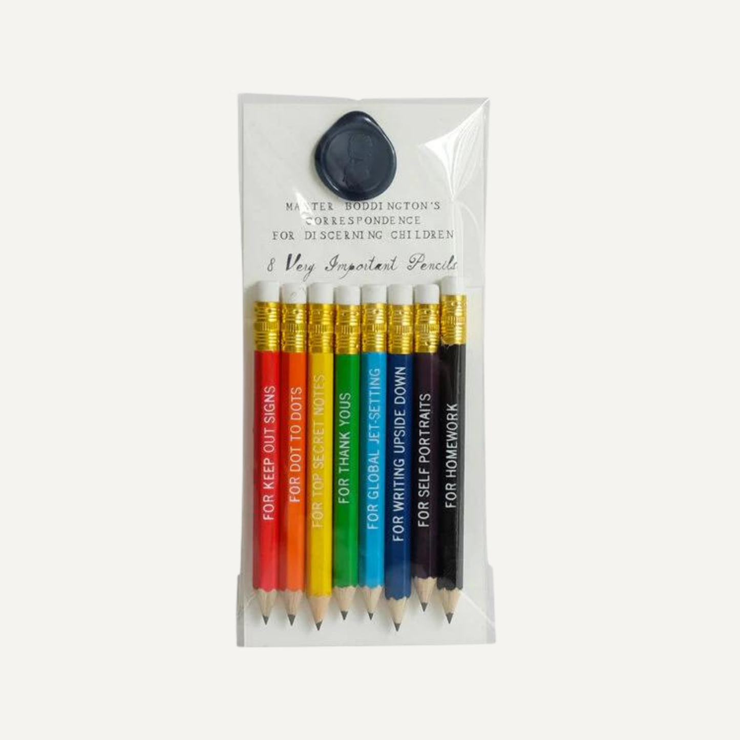 A set of writing pencils with phrases on them, inside a Mr. Boddington's package with an old fashioned wax seal
