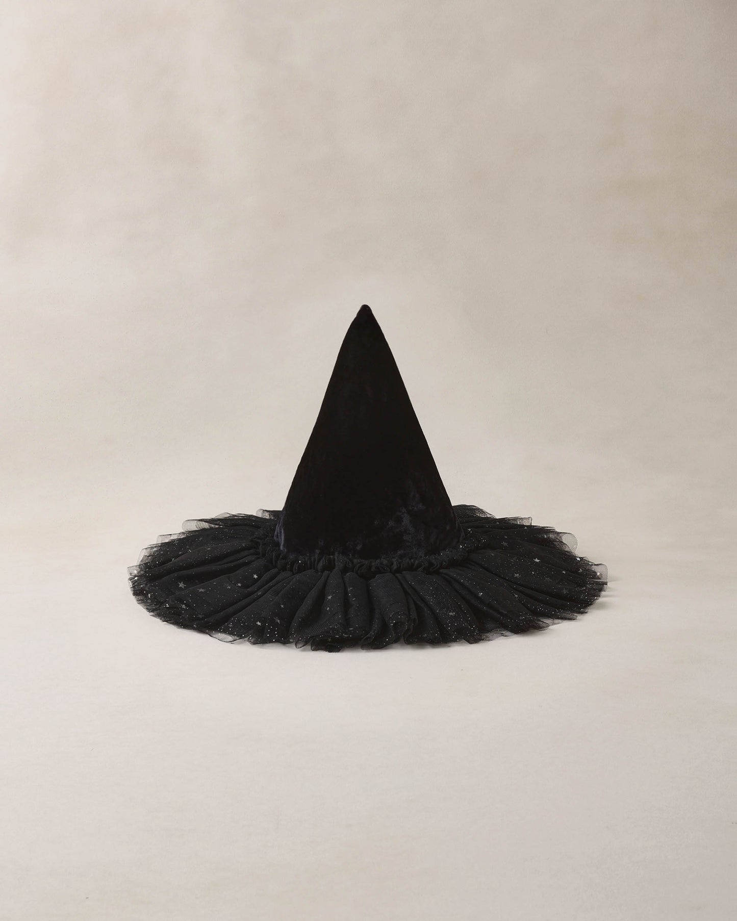 Witch hat in Black on beige background
