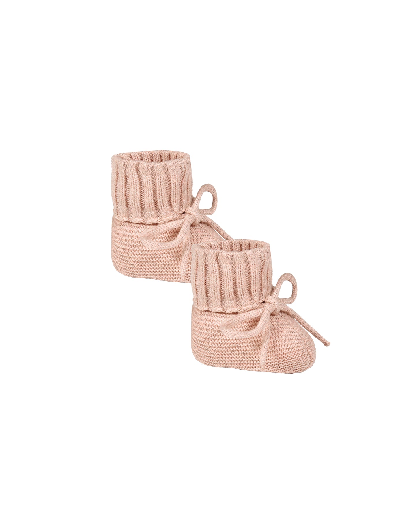 Pair of pink knitted baby booties on a white background