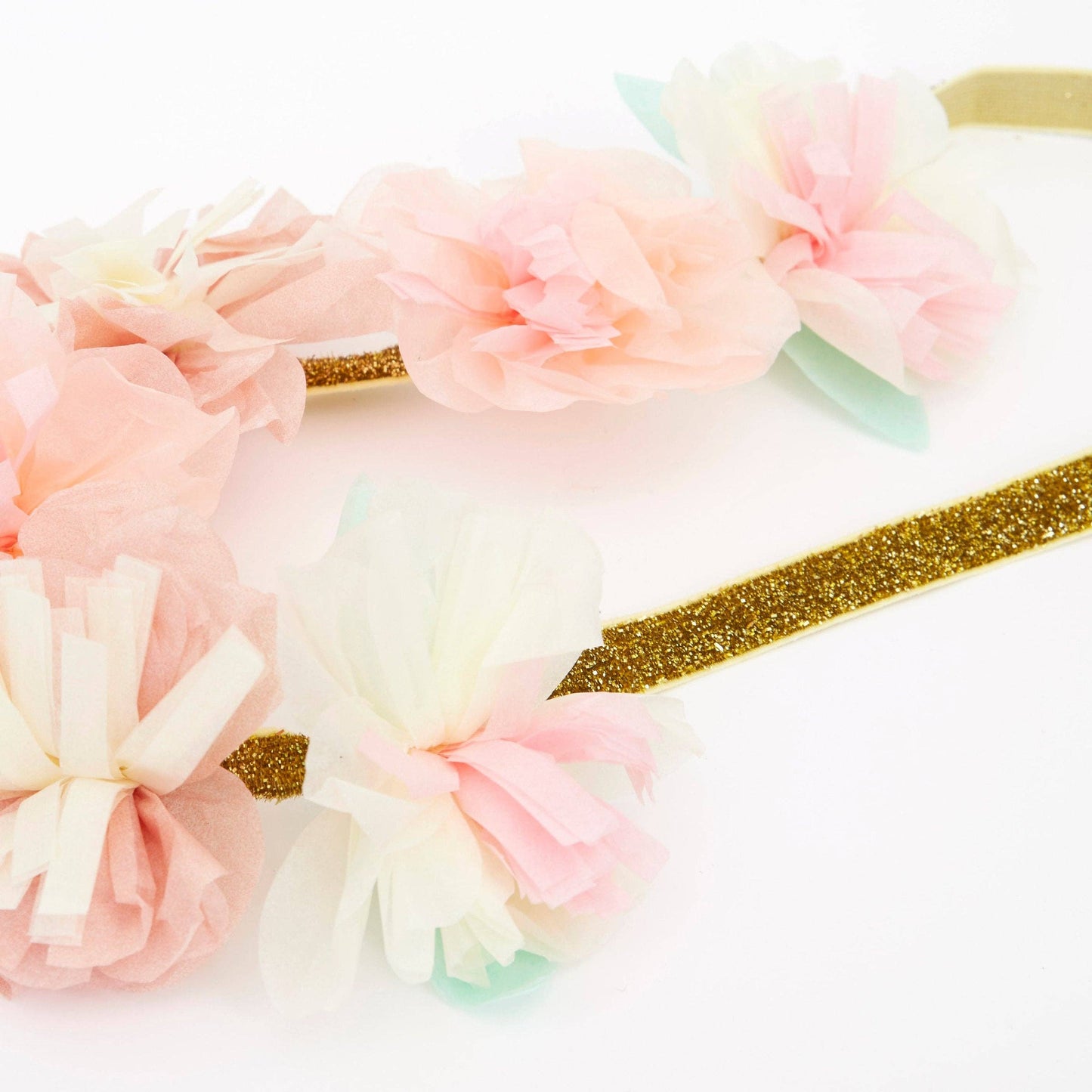 Floral headbands with gold accents on a white background