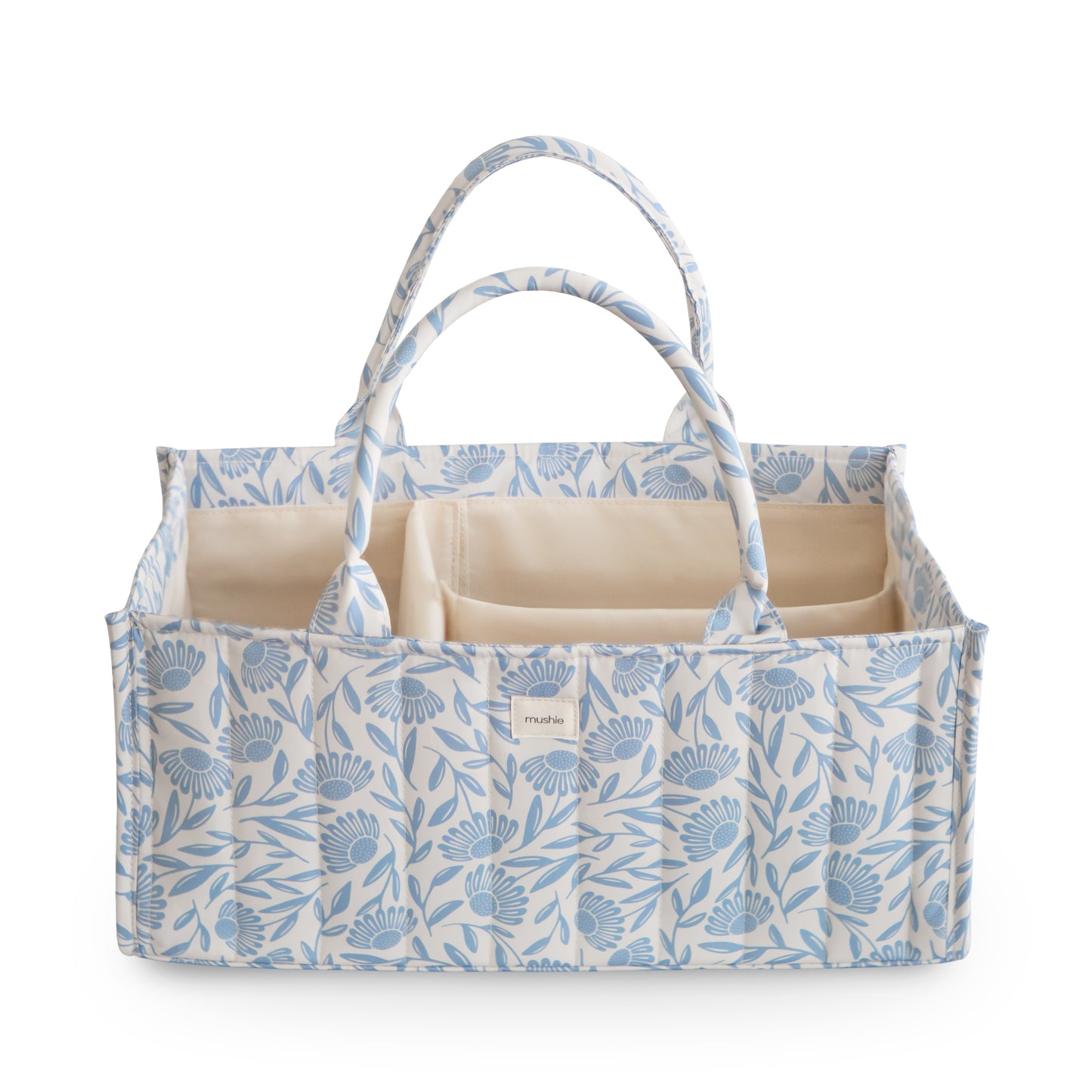 Blue floral-patterned baby changing bag with beige interior on a white background