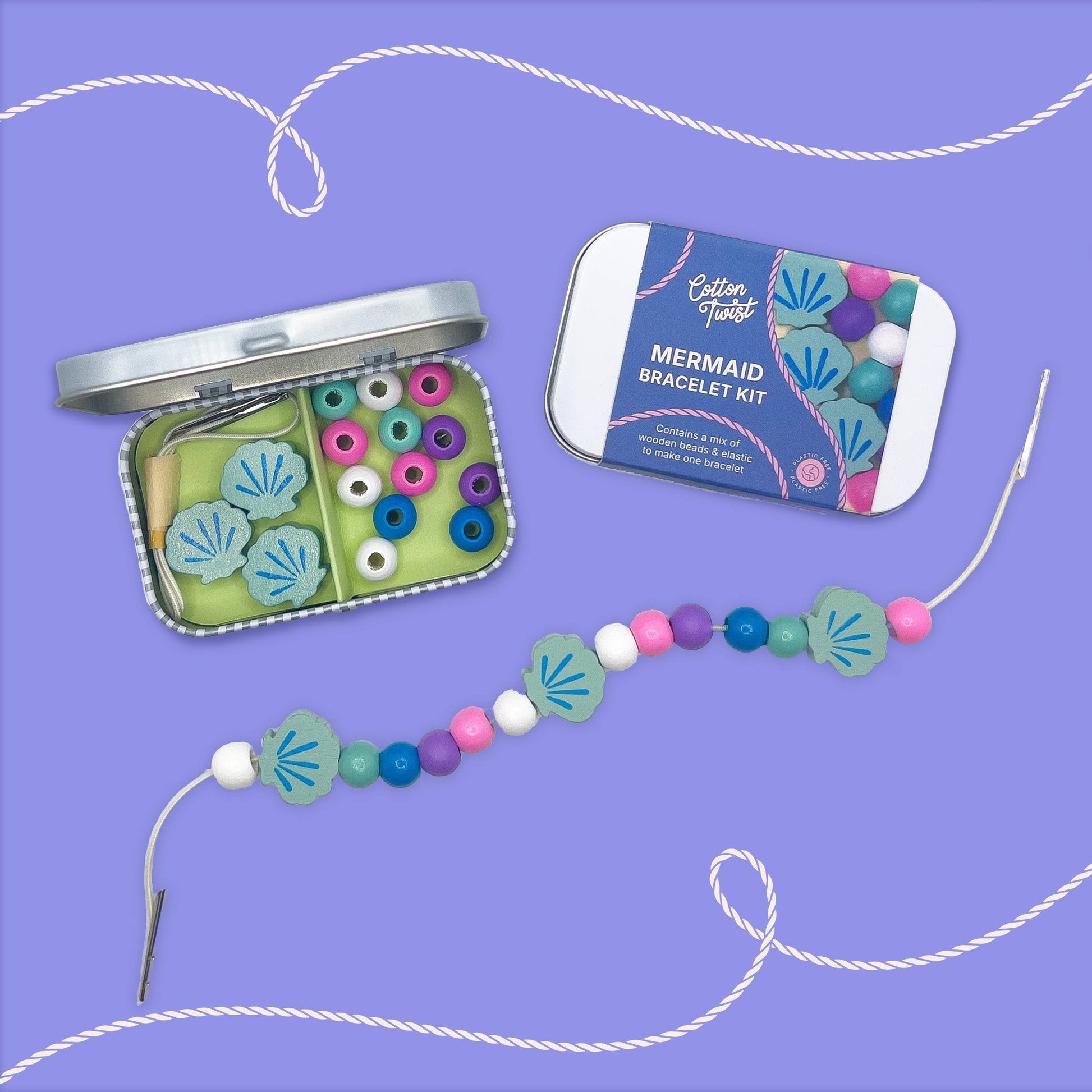 Mermaid bracelet kit with beads and packaging on a purple background