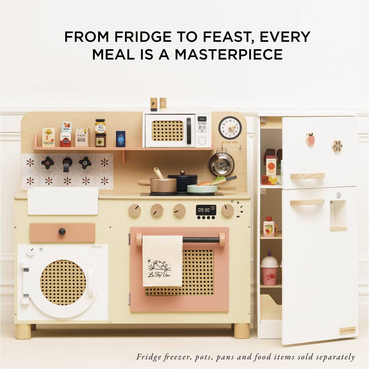 Toy kitchen set with various appliances and items on a white background, featuring text about meals.