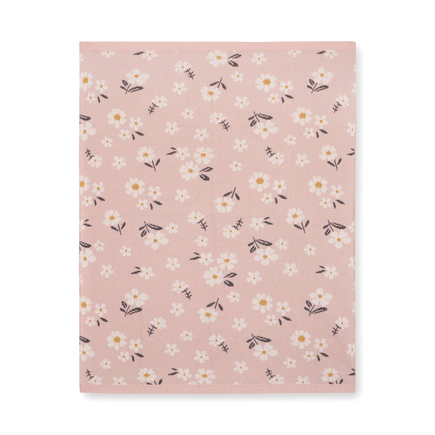 Floral patterned blanket with small white flowers on a pink background
