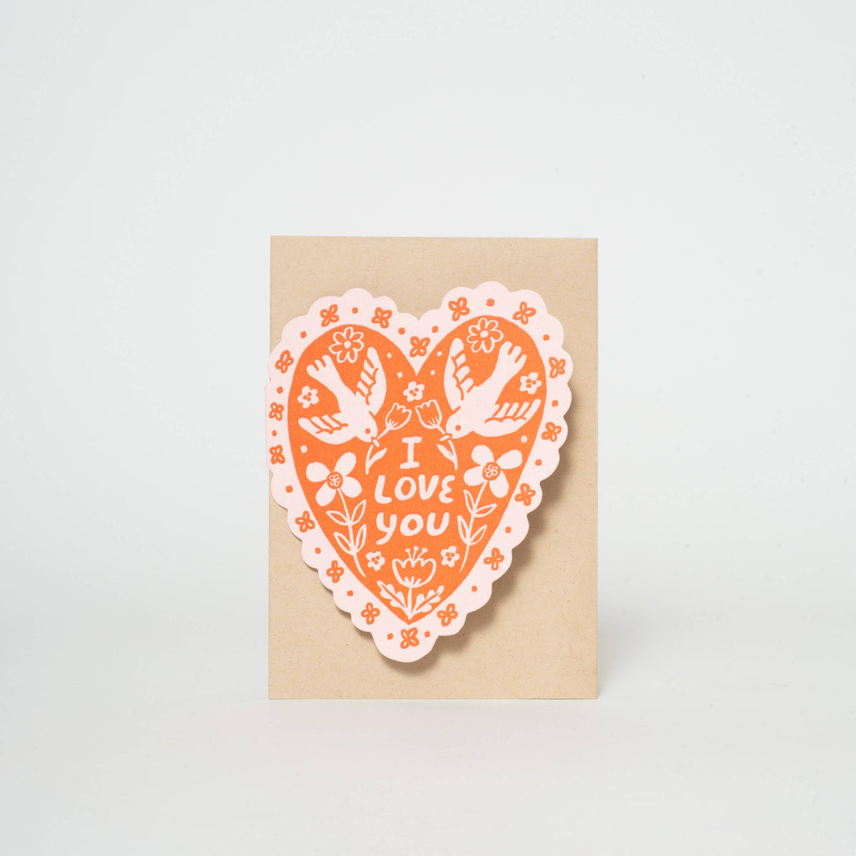 A love or Valentine's Day greeting card in a heart shape with dainty bird illustrations. Letterpress printed and packaged with a kraft paper envelope. 