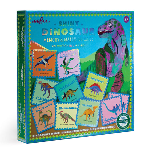 Dinosaur-themed memory and match game packaging with colorful illustrations on a white background