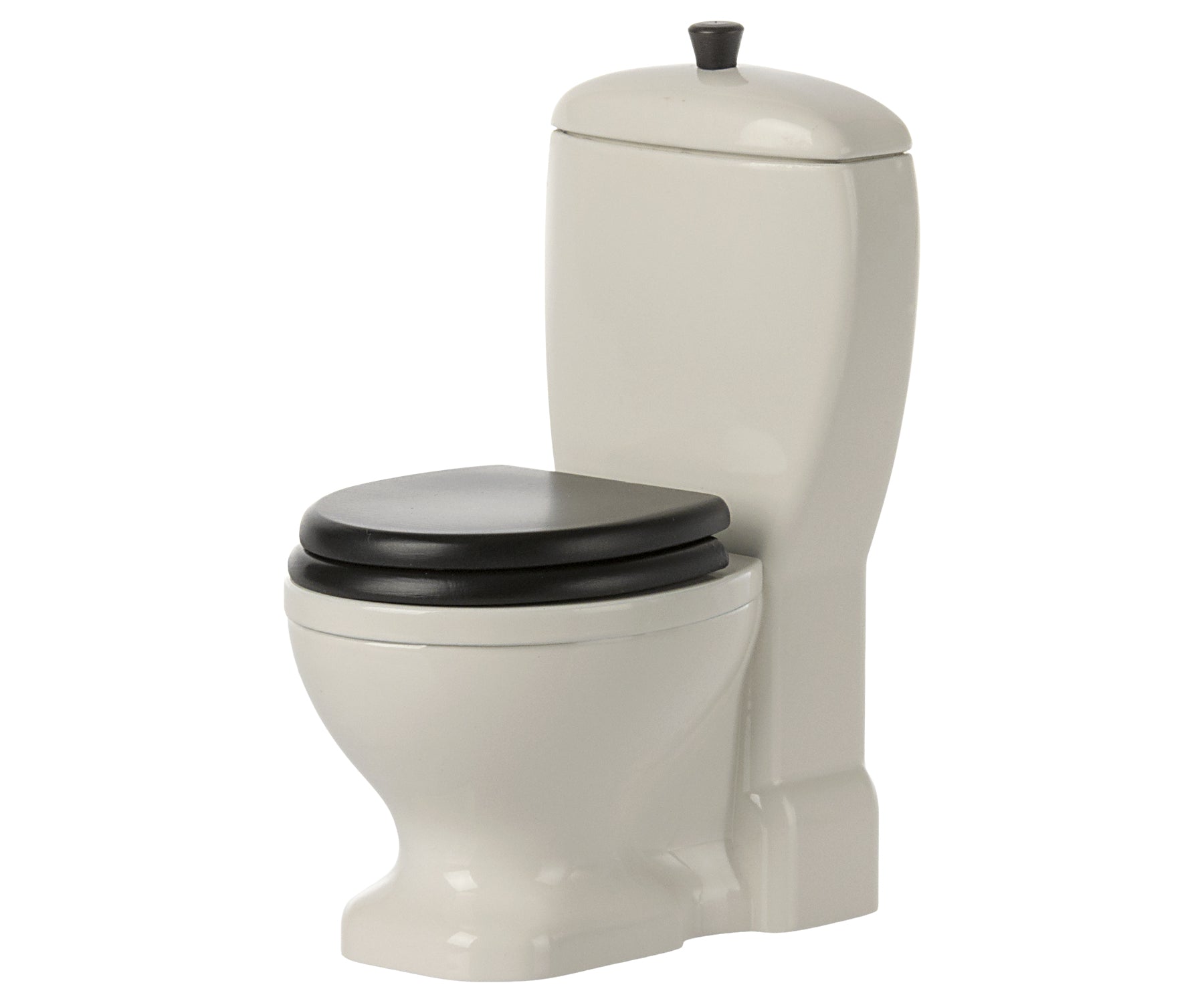 Beige dollhouse toilet with black seat on a white background