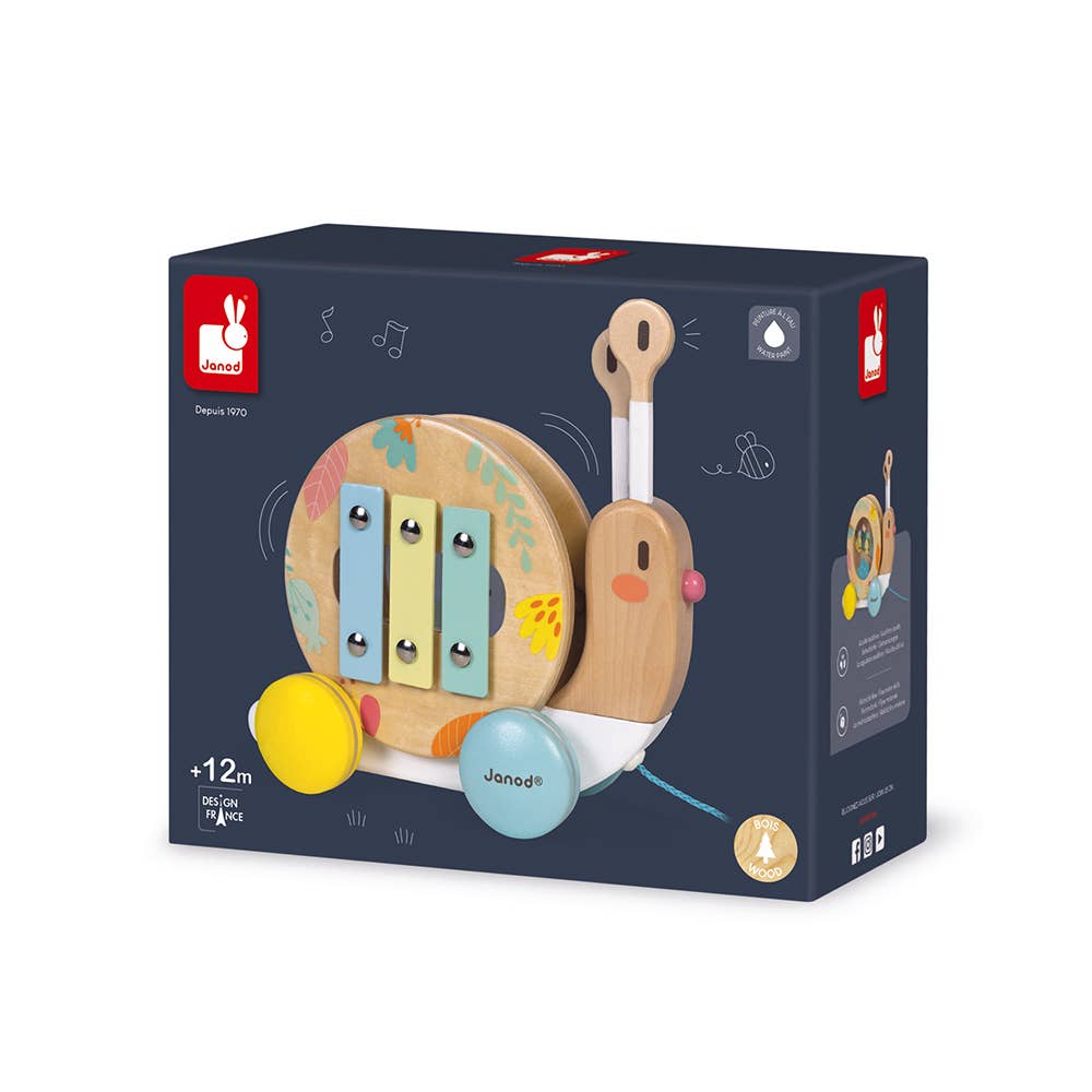 Wooden toy packaging with colorful design on a white background