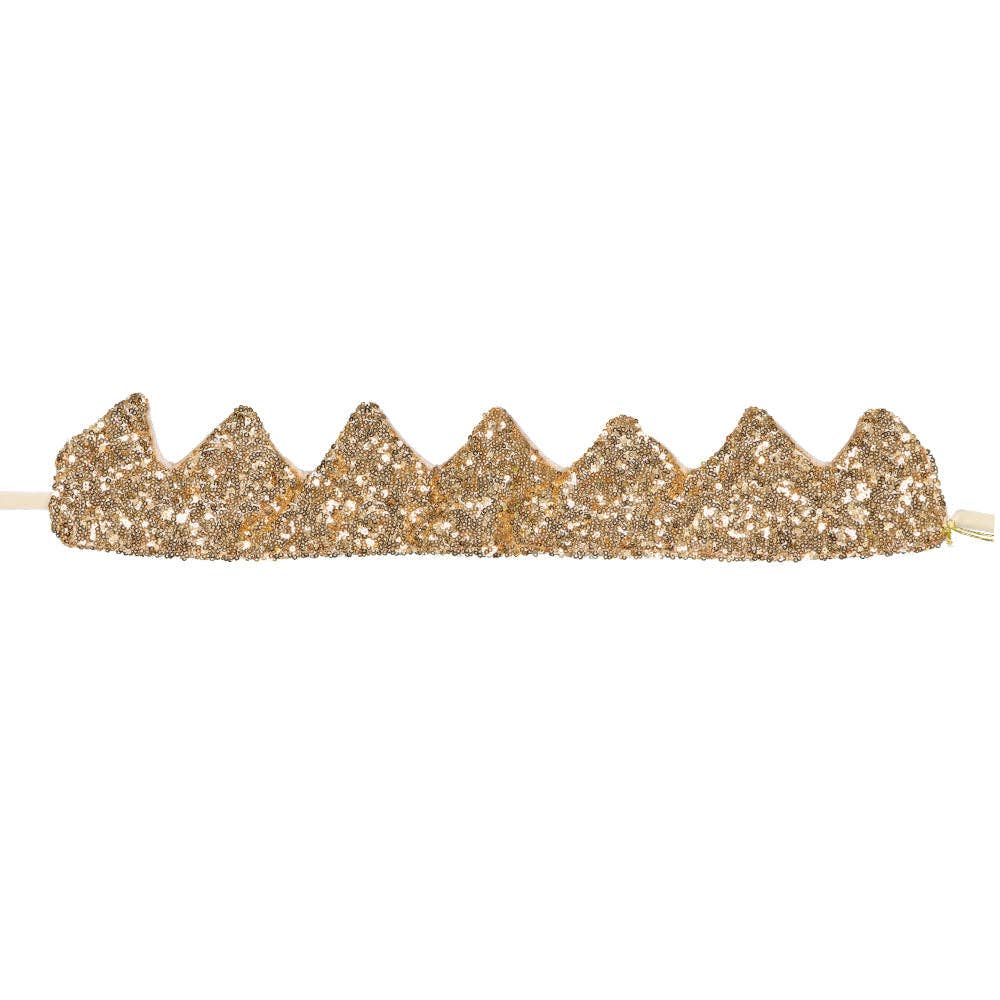 Gold glittery crown headband on a white background