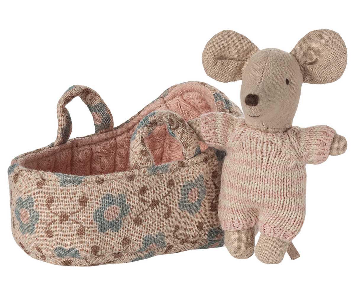 Knitted mouse toy with floral-patterned basket on a white background