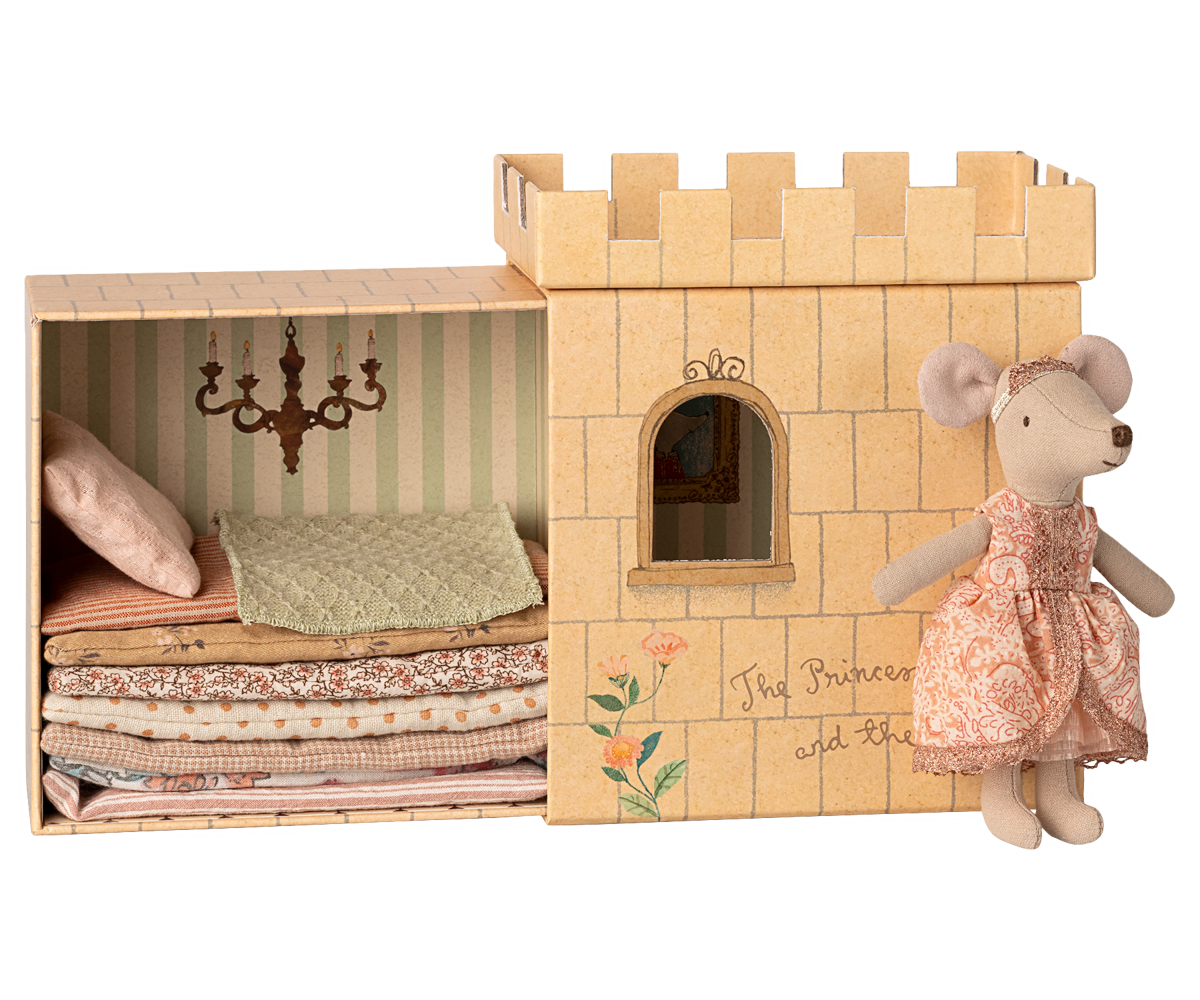 Paper castle toy with a mouse doll and fabric stack, featuring 'The Princess and the Pea' text.