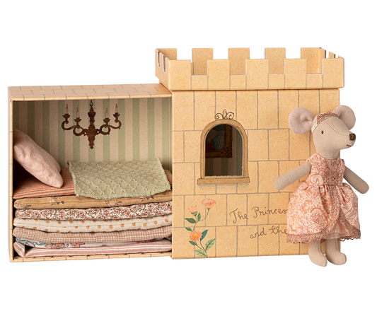 Paper castle toy with a mouse doll and fabric stack, featuring 'The Princess and the Pea' text.