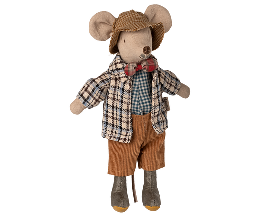 Stuffed mouse toy dressed in a checkered shirt, brown shorts, and a hat on a white background
