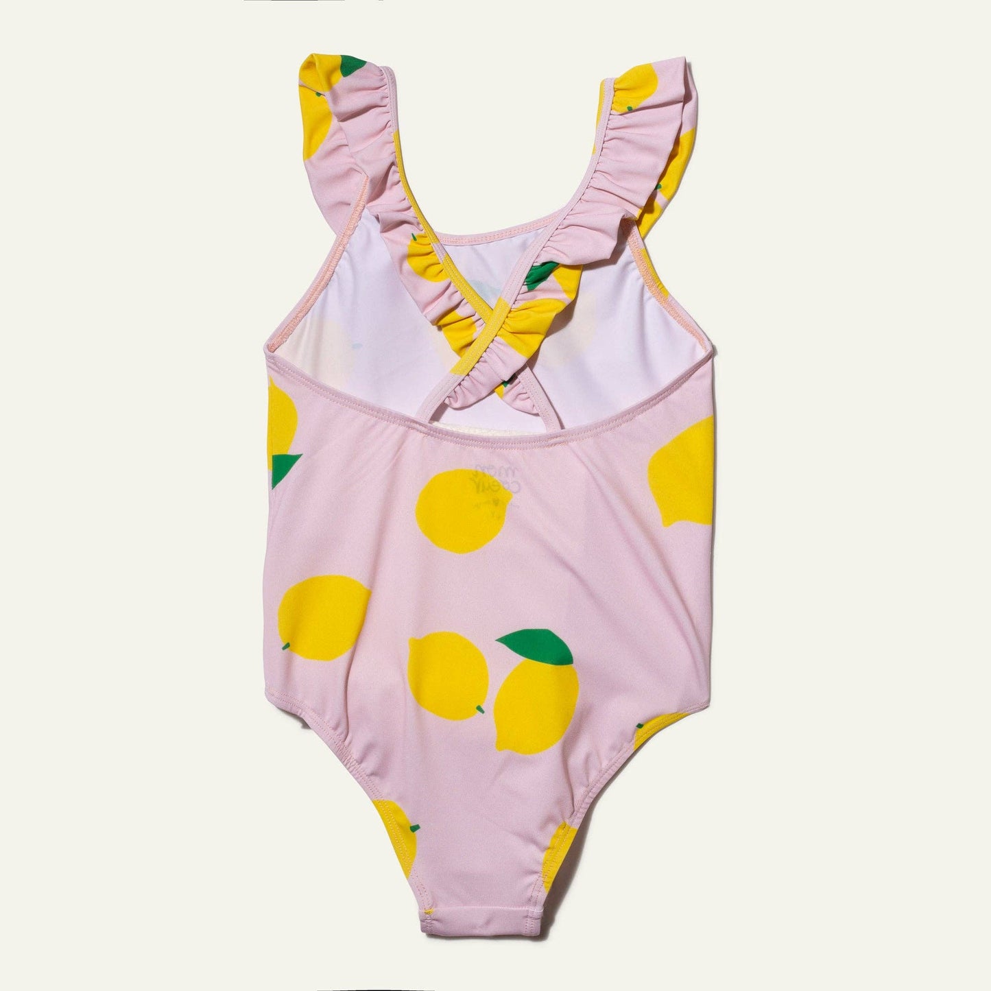 Back of pink one-piece swimsuit with lemon pattern on a white background