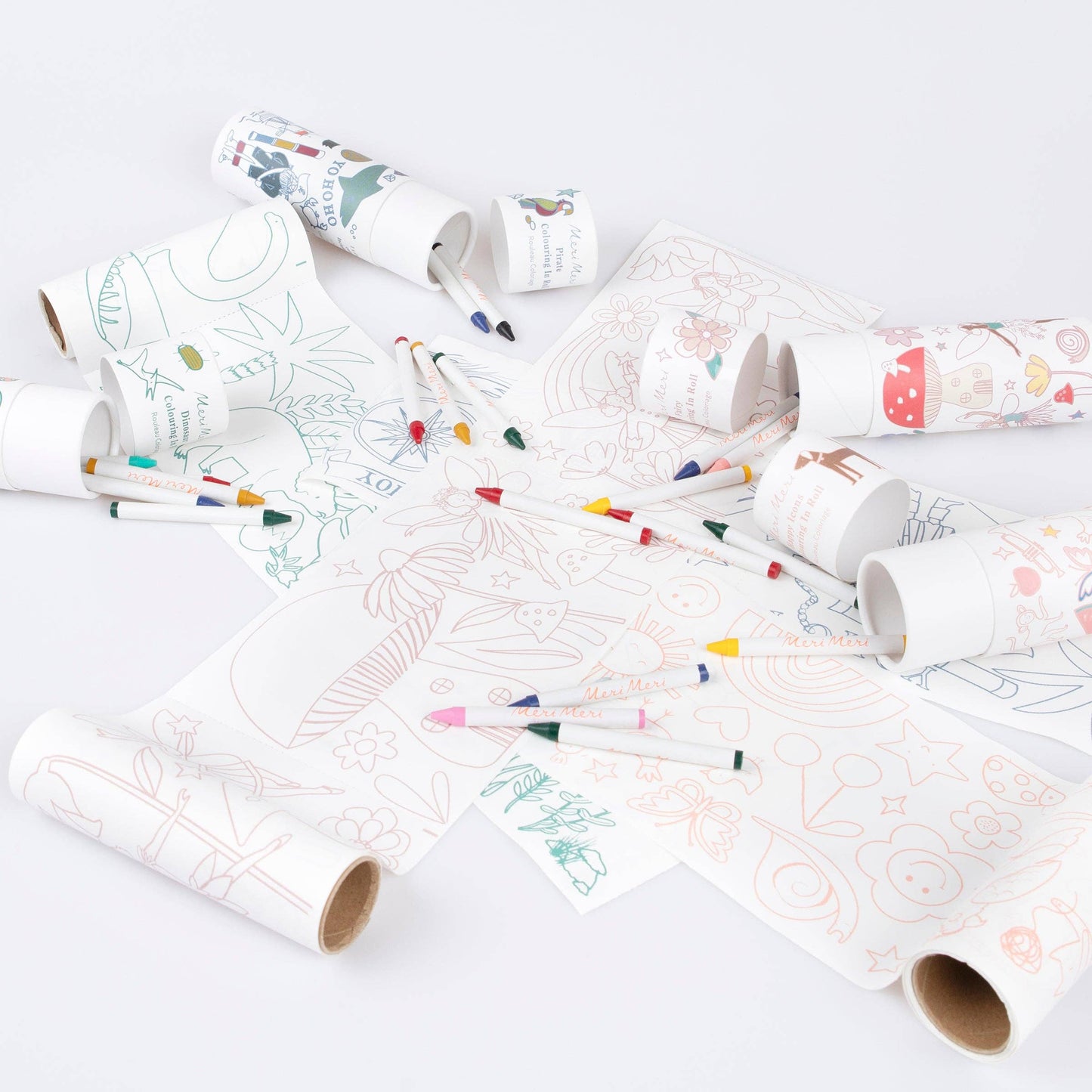 coloring roll sheets with paper tubes and crayons on white surface