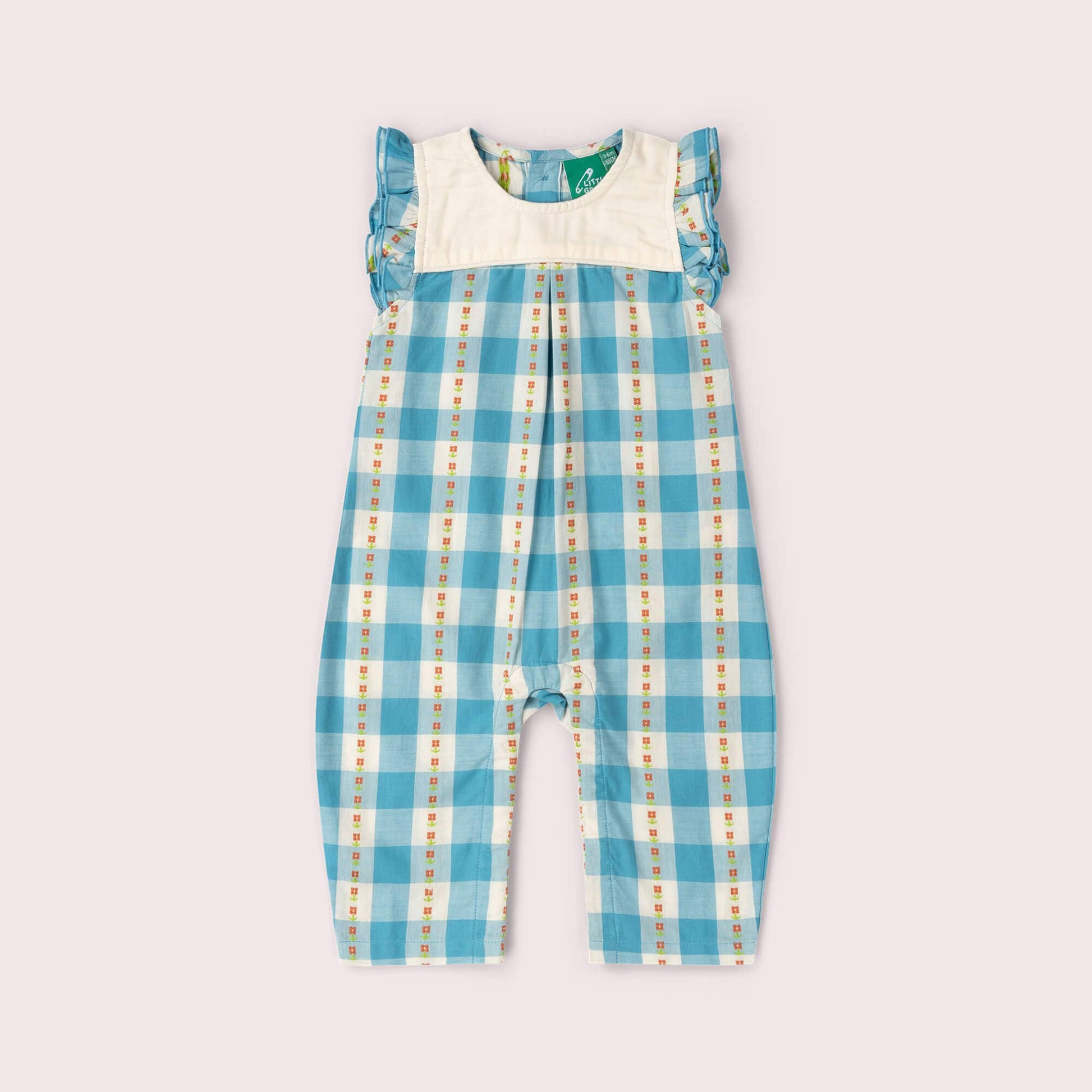 Blue checkered overalls with a white shirt underneath on a light gray background