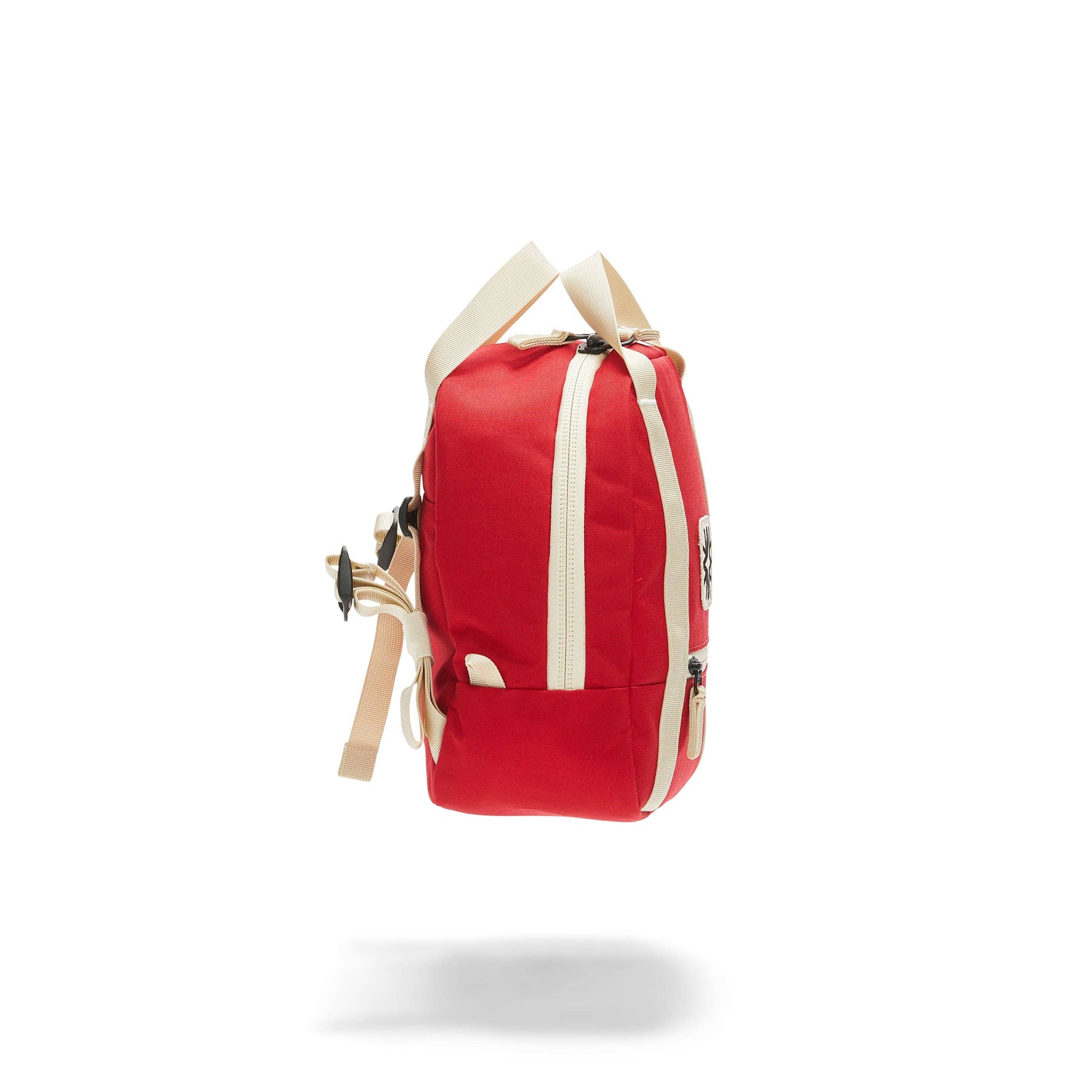 side view of red kids backpack with ivory straps
