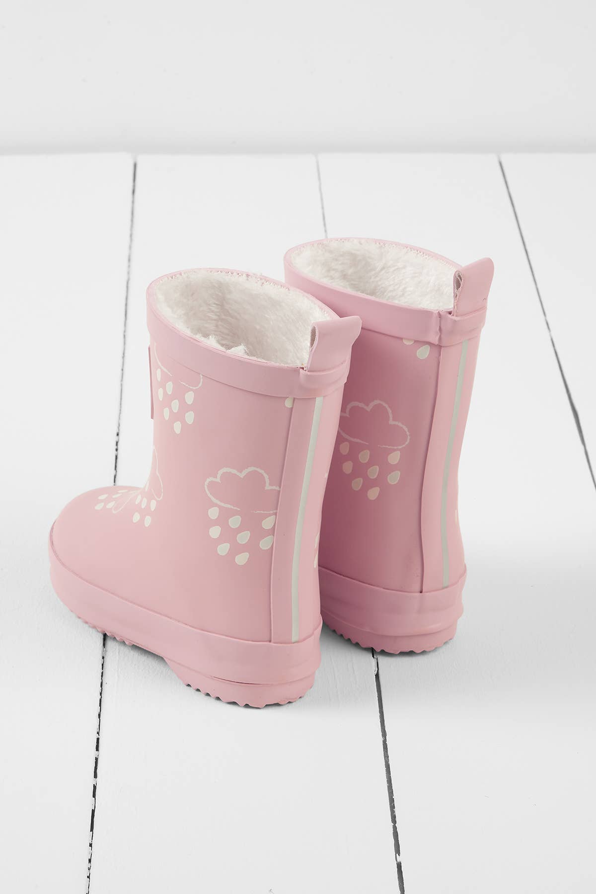 pink faux fur lined kids rainboots on a white background