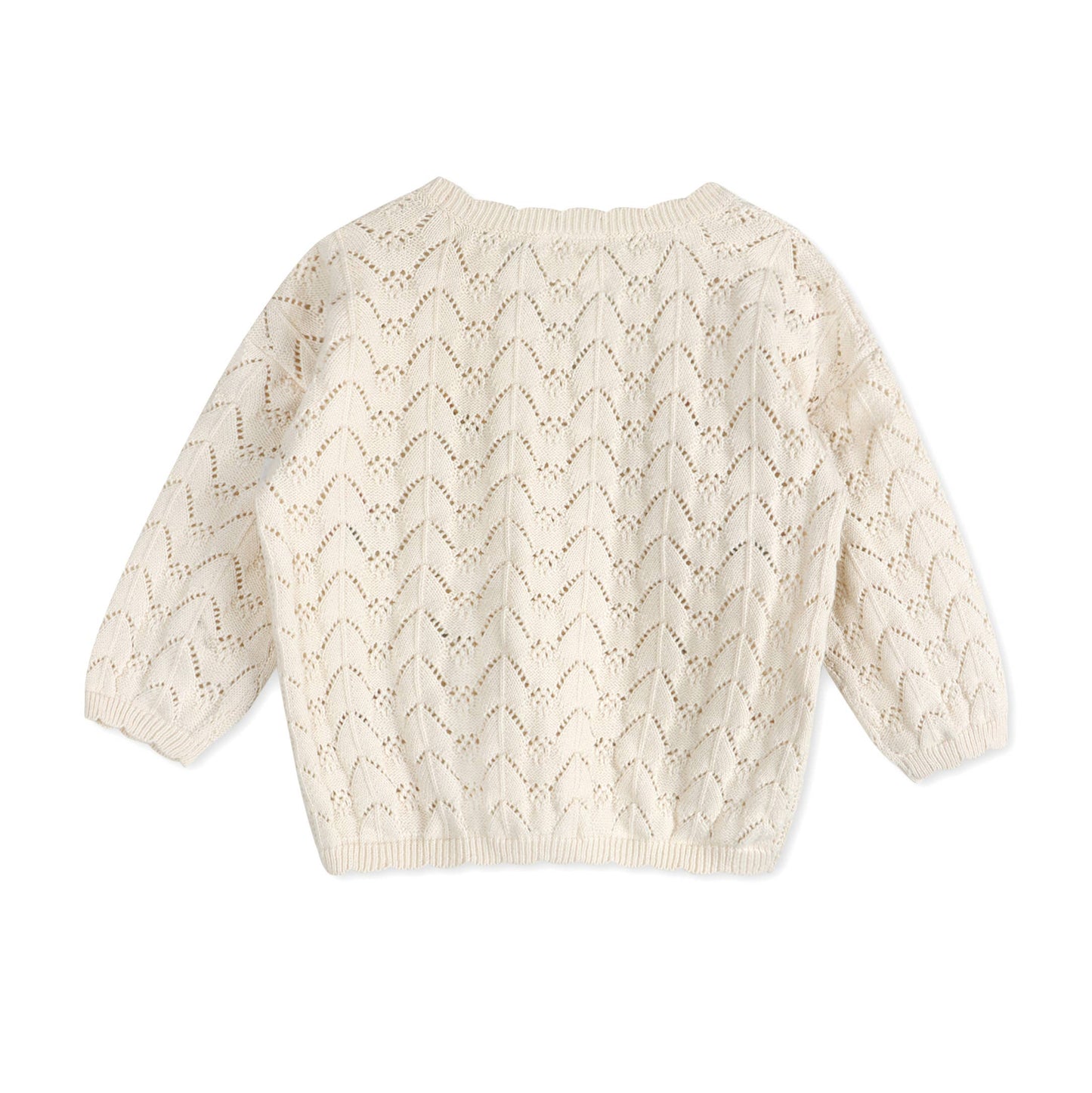 Back of cream-colored knitted sweater on a white background