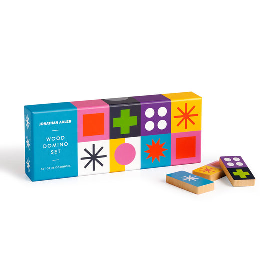 Colorful box of Jonathan Adler wood domino set with dominoes on a white background