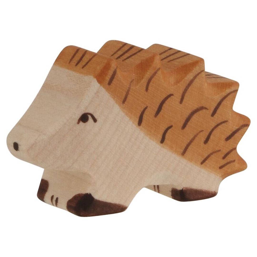 Wooden hedgehog toy on a white background