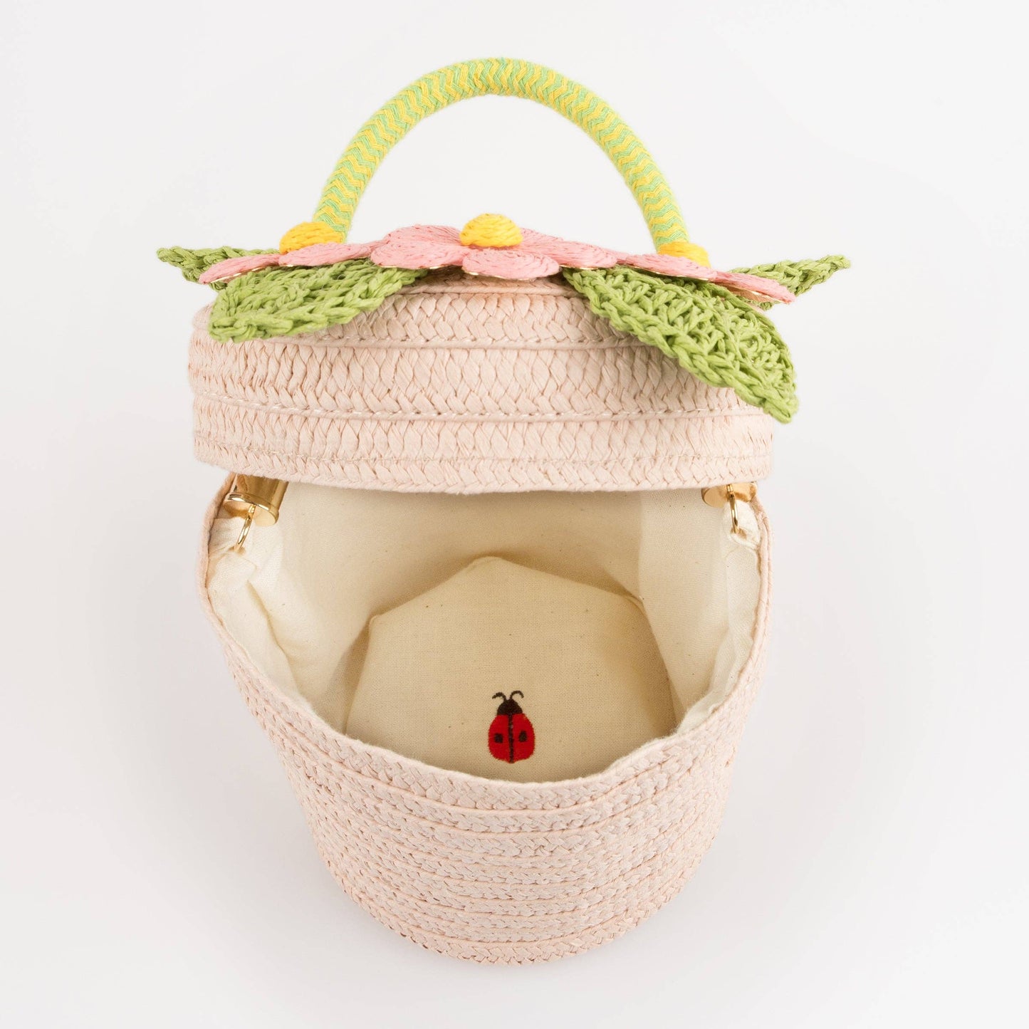 Woven basket with floral top on a white background