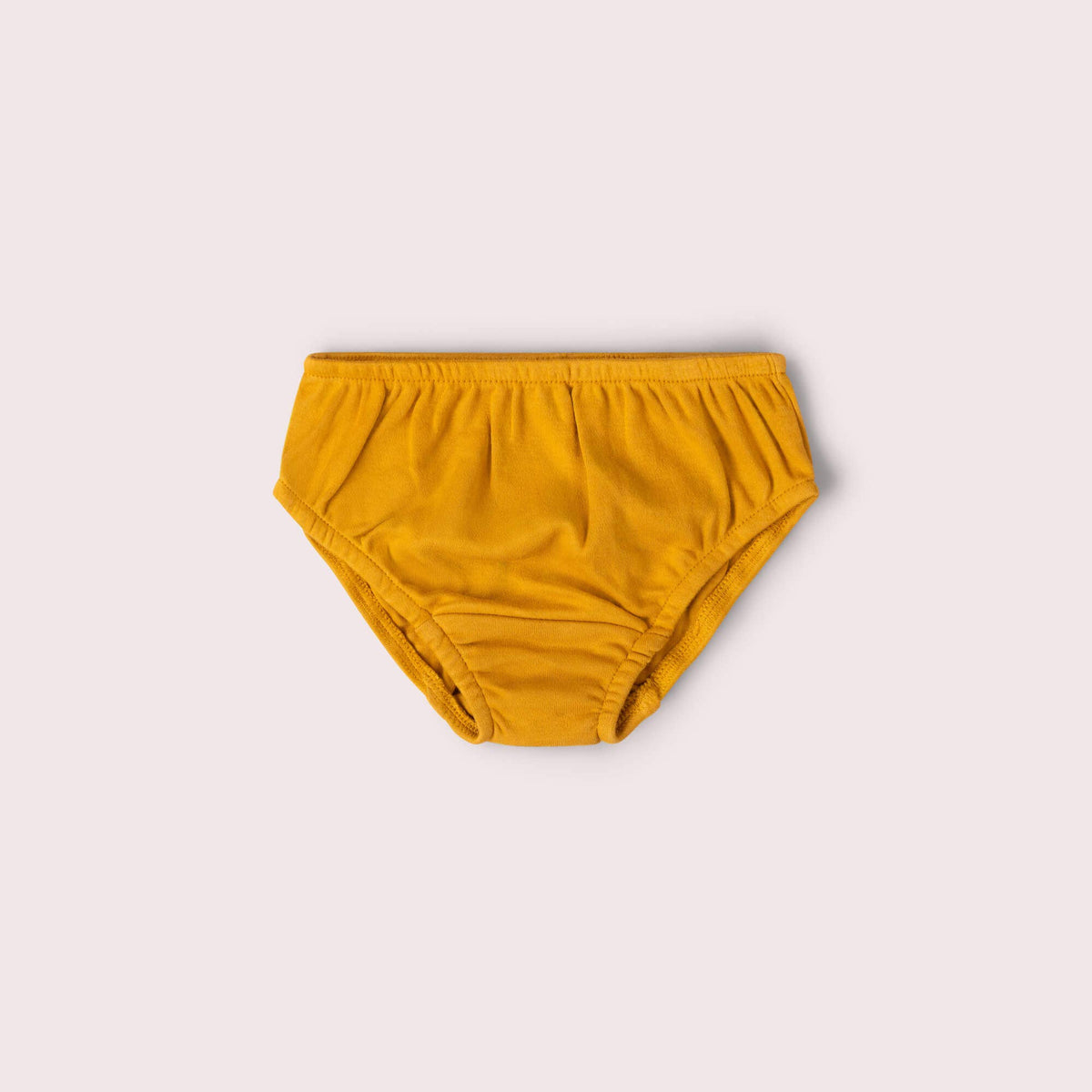 Mustard yellow children's underwear with elastic waistband.