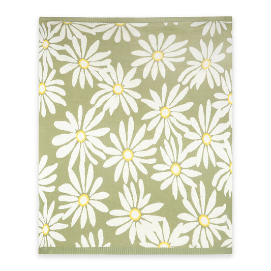 Patterned blanket with white flowers on a green background
