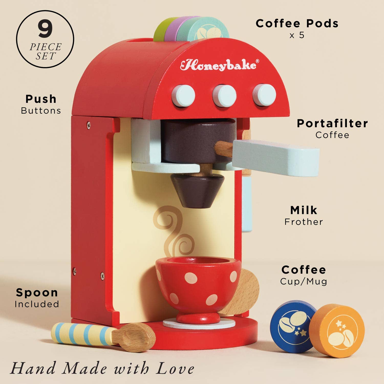 Toy coffee machine set with various components on a beige background