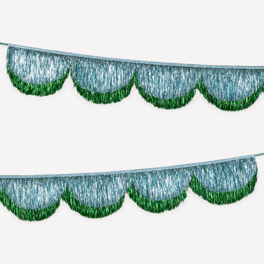 Decorative metallic fringe garland with green edges on a white background