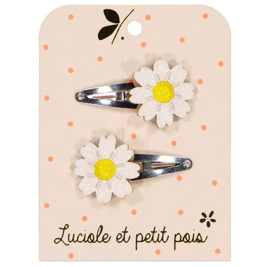 Two flower-shaped hair clips on a branded card with 'Luciole et petit pois' text.