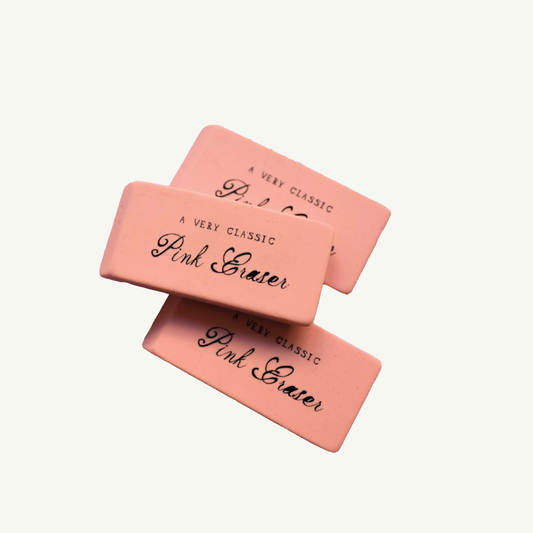 3 classic pink pencil erasers on a white background