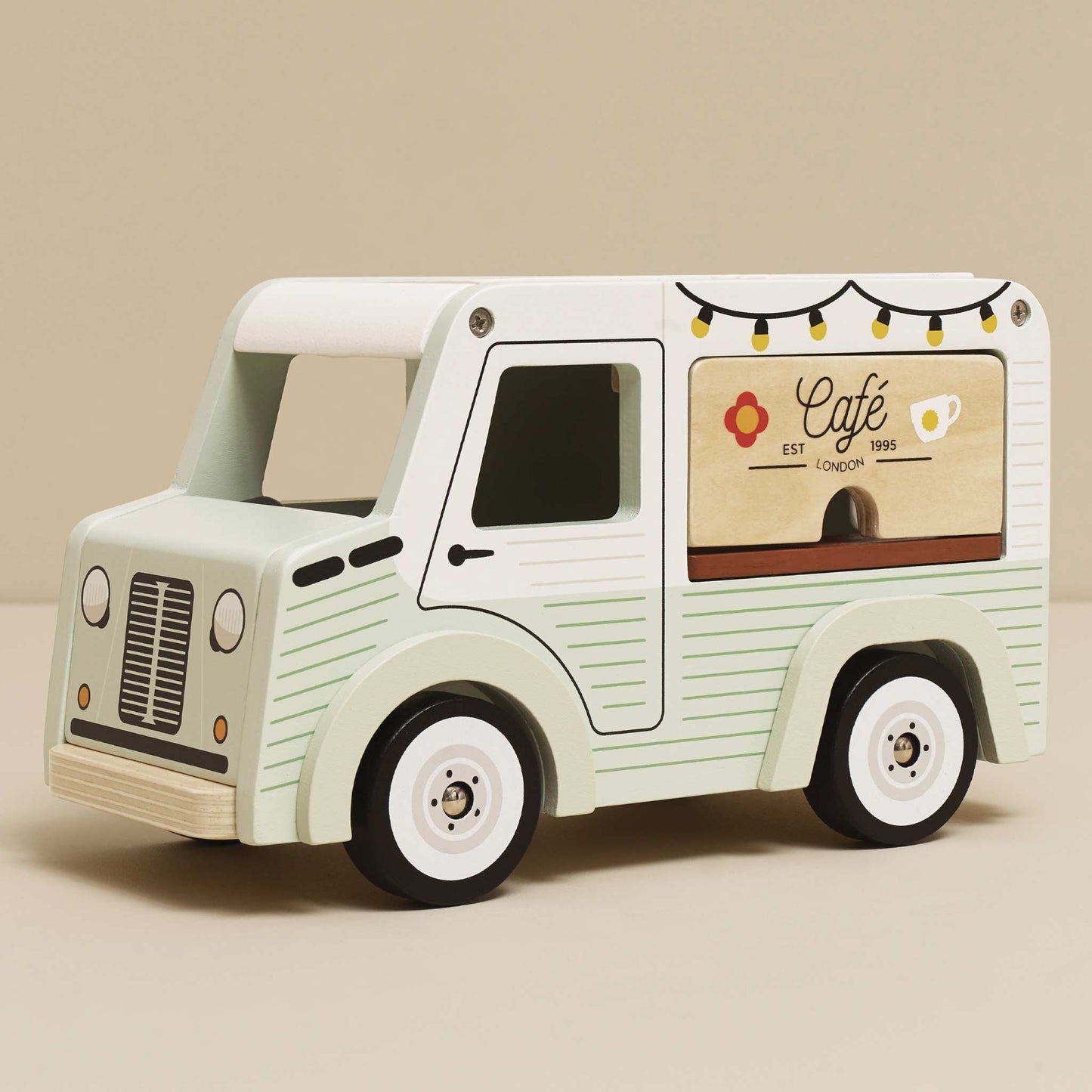 Toy cafe truck with a beige background