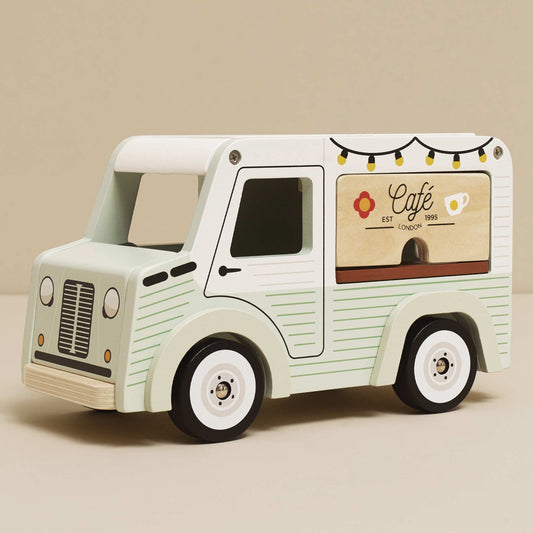 Toy cafe truck with a beige background