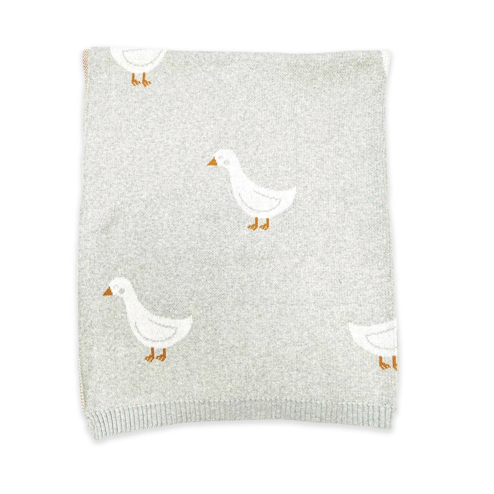 Gray blanket with white duck designs on a white background