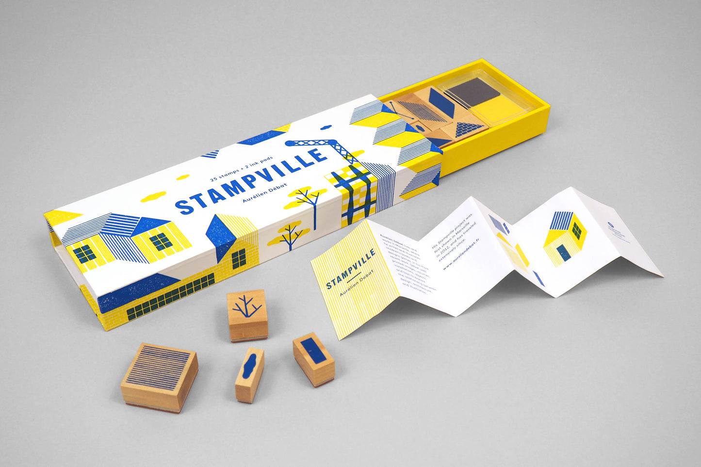 Stampville stamp set with packaging on a gray background