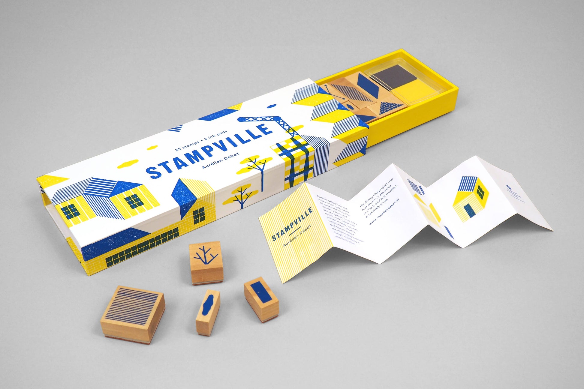 Stampville stamp set with packaging on a gray background