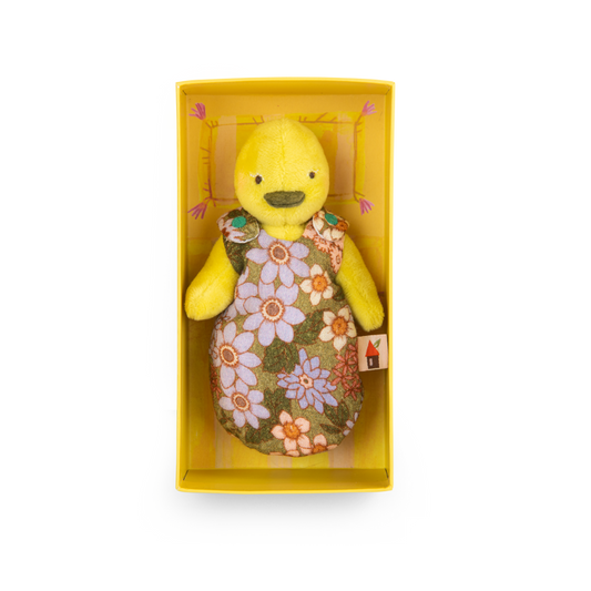 Yellow duck plush toy with floral pattern in a yellow box on a white background