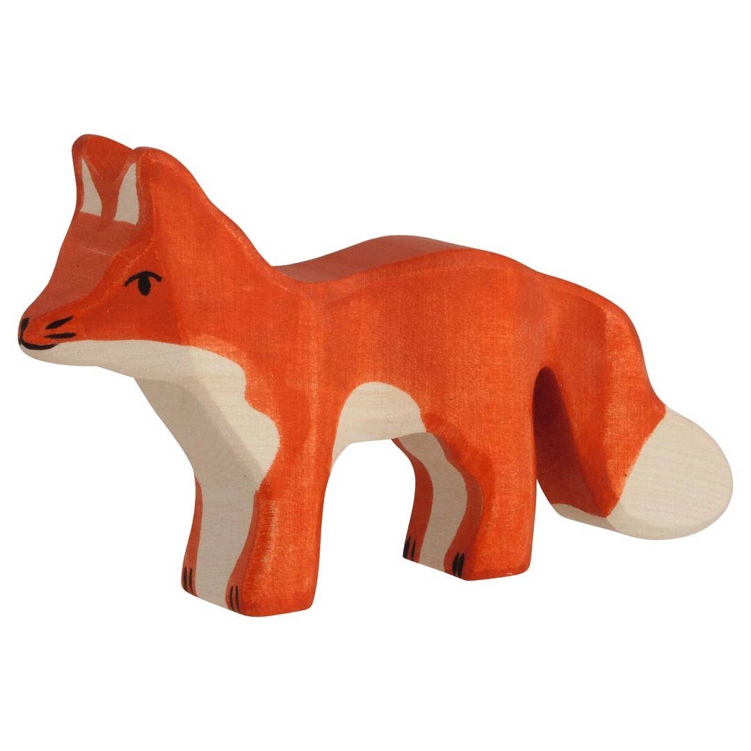 Wooden fox figurine on a white background
