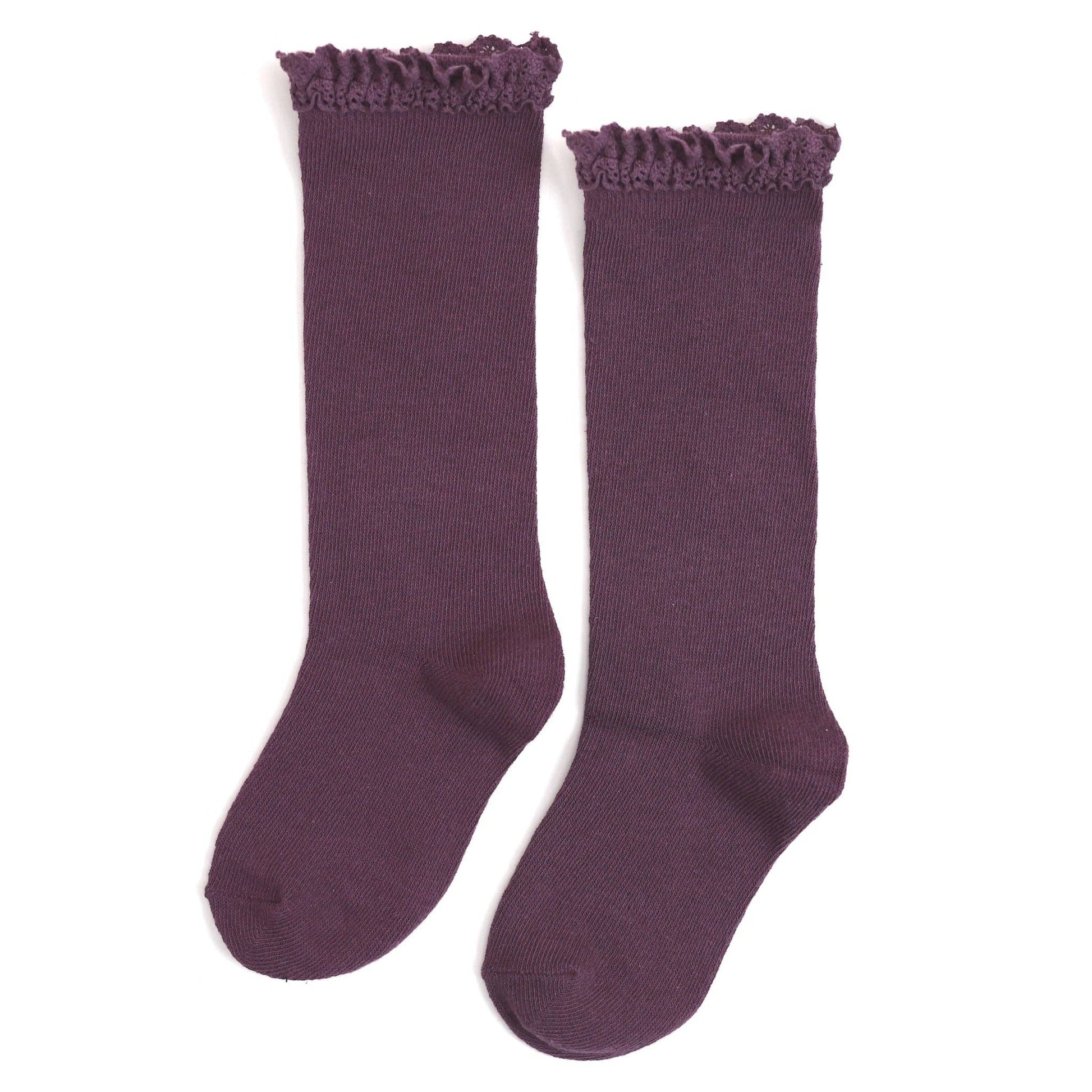 Pair of purple knee-high socks with ruffled top on a white background