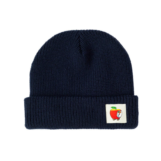 Navy blue beanie with a small label featuring a cartoon character on a white background